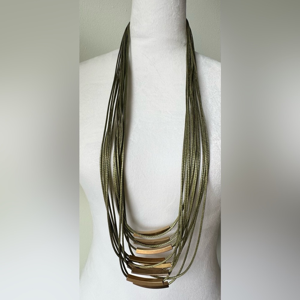 NWOT Zzan long multi-strand necklace green cords & gold colored metal accents.